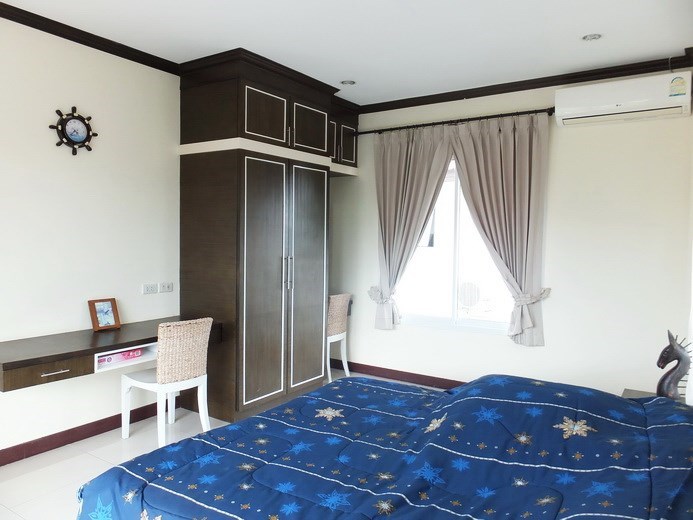 House for sale Na Jomtien Pattaya showing the second bedroom and built-in wardrobes 