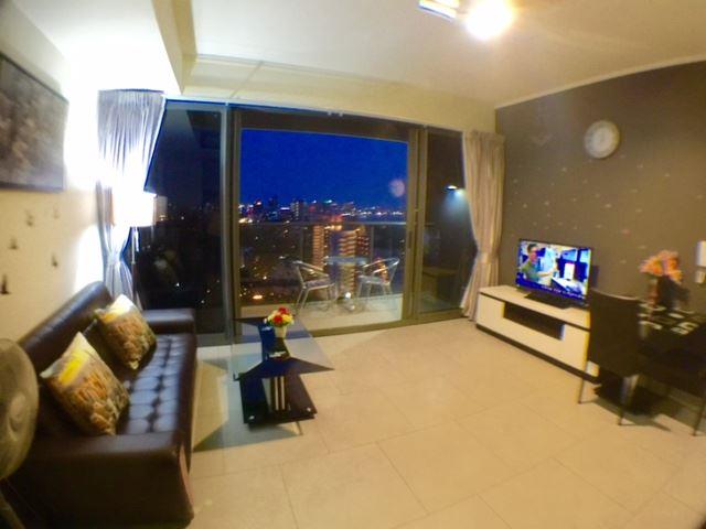 Condominium for sale at Zire Pattaya showing the living room and balcony view Condominium for sale at Zire Pattaya showing the living room and balcony view