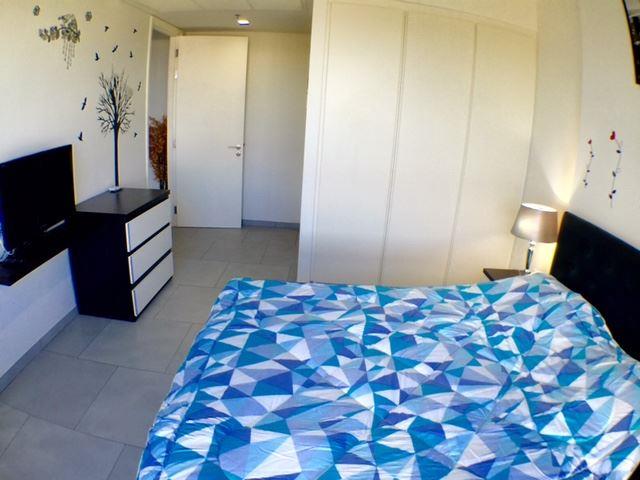 Condominium for sale at Zire Pattaya showing the bedroom suite Condominium for sale at Zire Pattaya showing the bedroom suite