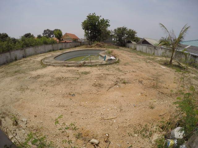 Land for sale Pattaya showing the land and derelict swimming pool Land for sale Pattaya showing the land and derelict swimming pool