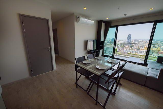 Condominium for sale Pattaya showing the living area and the balcony Condominium for sale Pattaya showing the living area and the balcony