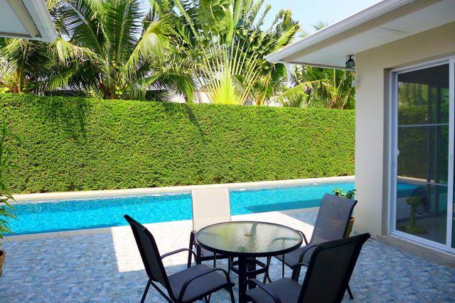 House for sale East Pattaya showing a poolside terrace House for sale East Pattaya showing a poolside terrace