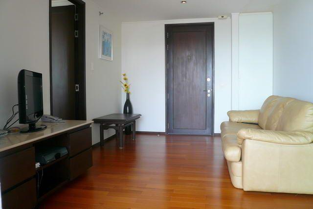 Condominium for sale in Pattaya showing the sitting area and TV Condominium for sale in Pattaya showing the sitting area and TV