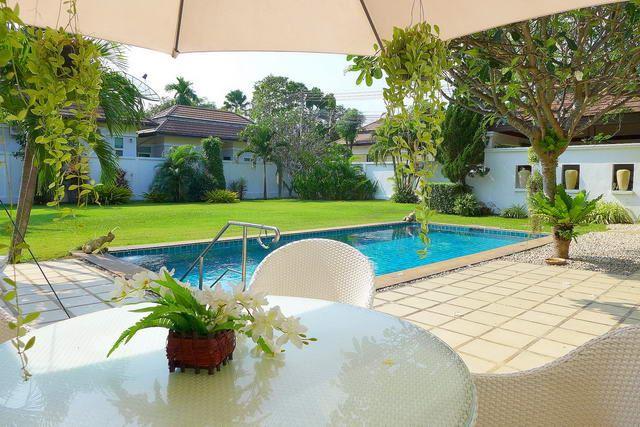 House for sale East Pattaya showing the poolside terrace and garden House for sale East Pattaya showing the poolside terrace and garden