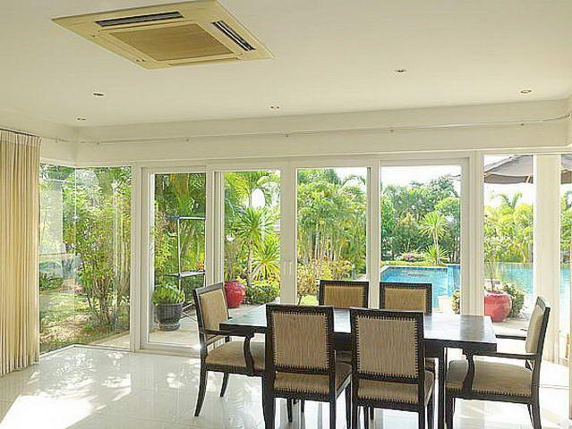 House for sale Siam Royal View Pattaya showing the dining area poolside House for sale Siam Royal View Pattaya showing the dining area poolside