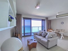 Condominium for rent Wong Amat Pattaya showing the living, dining areas and balcony 
