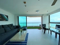 Condominium for sale Pattaya showing the living area and balcony 