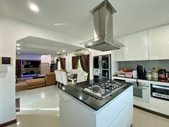 House for sale East Pattaya showing the kitchen, dining and living areas 