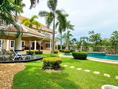 House for sale Mabprachan Pattaya showing the covered terrace and garden 