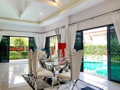 House for Sale Pattaya showing the dining area pool view 