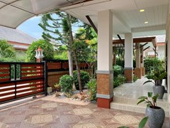 House for Sale Pattaya showing the garden and covered terrace 