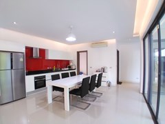 House for sale Mabprachan Pattaya showing the dining, kitchen and guest bathroom 