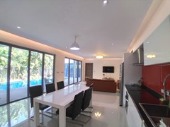 House for sale Mabprachan Pattaya showing the kitchen, dining and living areas 