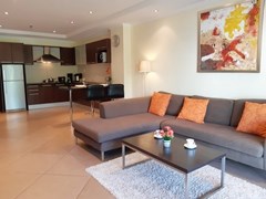 Condominium for rent Jomtien showing the living, dining and kitchen areas 