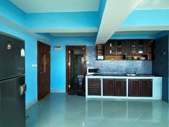 Condominium for rent Pratumnak showing the kitchen and guest bathroom 