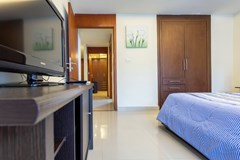 Condominium for sale Pattaya showing the master bedroom with furniture 