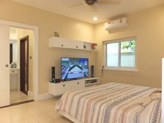 House for sale Nongpalai Pattaya showing the second bedroom suite with walk-in wardrobes 