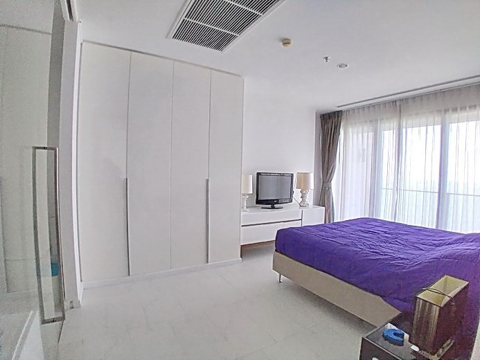 Condominium for sale Northpoint Pattaya showing the master bedroom and wardrobes  