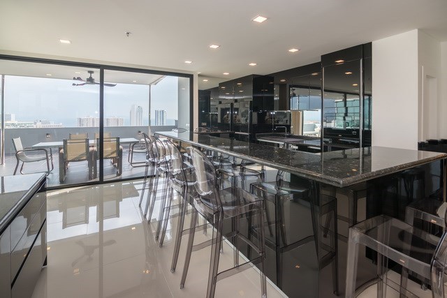 Condominium for sale Pratumnak Pattaya showing the dining, kitchen and balcony Condominium for sale Pratumnak Pattaya showing the dining, kitchen and balcony