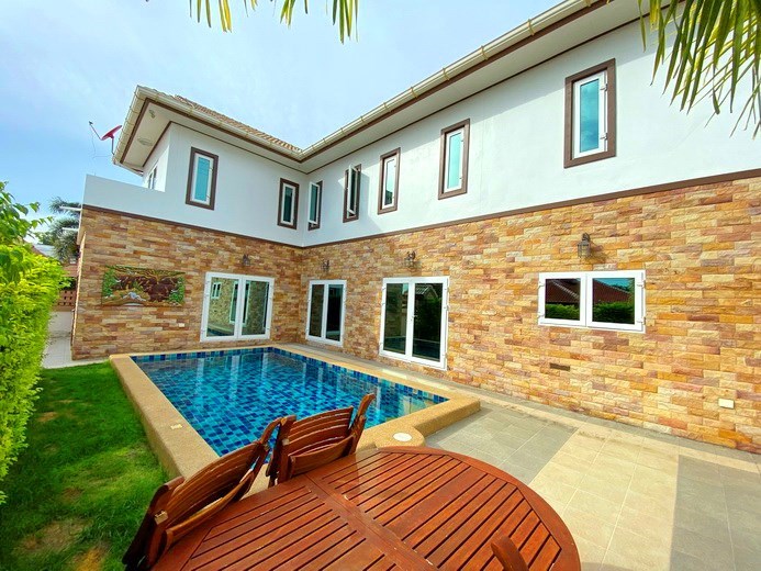 House for sale East Pattaya showing the poolside terrace and house 