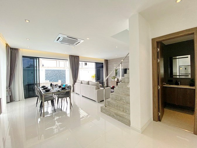 House for sale Huay Yai Pattaya showing the dining area and guest bathroom 