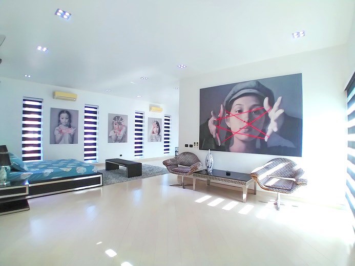 House for sale Jomtien showing the master bedroom with living area House for sale Jomtien showing the master bedroom with living area