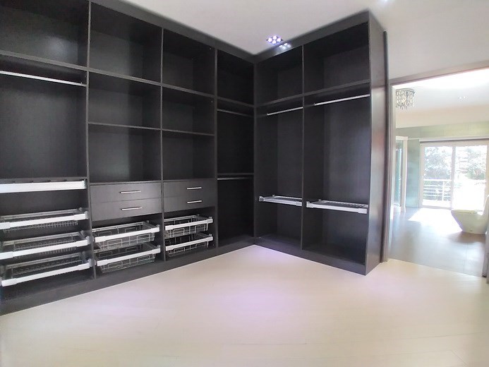 House for sale Jomtien showing the master bedroom with walk-in wardrobes House for sale Jomtien showing the master bedroom with walk-in wardrobes