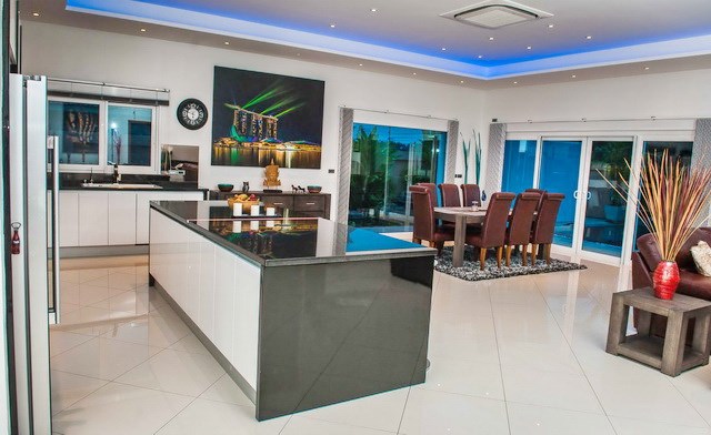 House for sale Mabprachan Pattaya showing the kitchen and dining areas House for sale Mabprachan Pattaya showing the kitchen and dining areas
