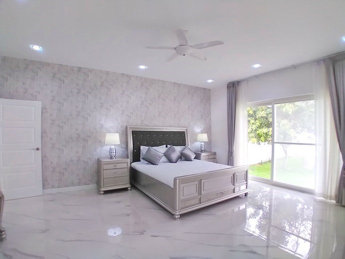 House for sale Pattaya showing the first bedroom ground floor and garden view House for sale Pattaya showing the first bedroom ground floor and garden view