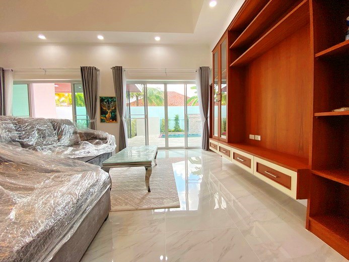 House for sale Pattaya showing the living area and built-in cabinet 