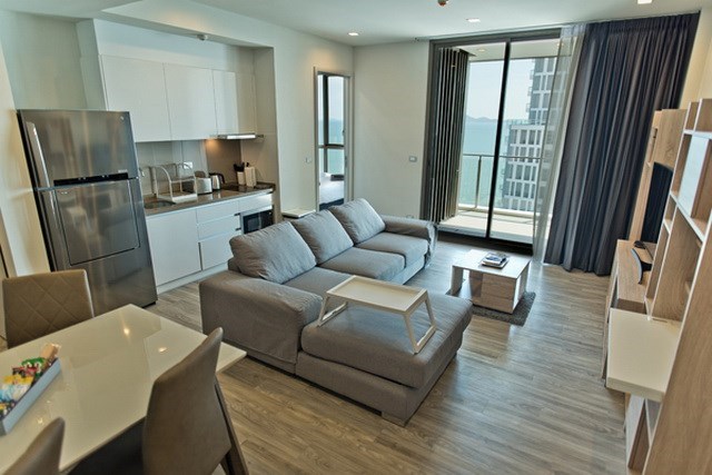 Condominium for sale Wongamat Pattaya showing the living and kitchen areas Condominium for sale Wongamat Pattaya showing the living and kitchen areas