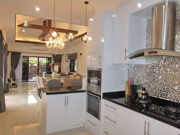 House for Sale Pattaya showing the kitchen, dining and living areas 